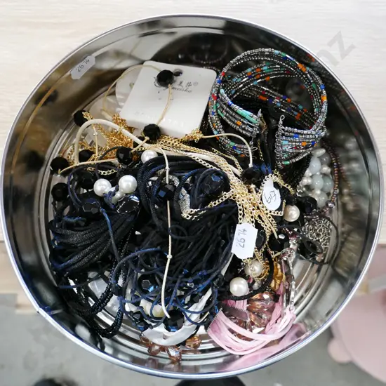 tin of costume jewellery