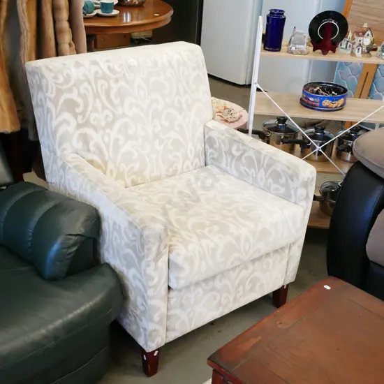 fleur de lis patterned armchair