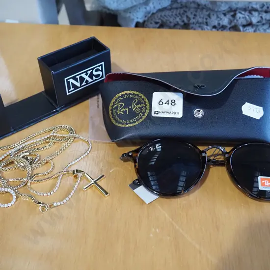 sunglasses, golden crucifix on chain