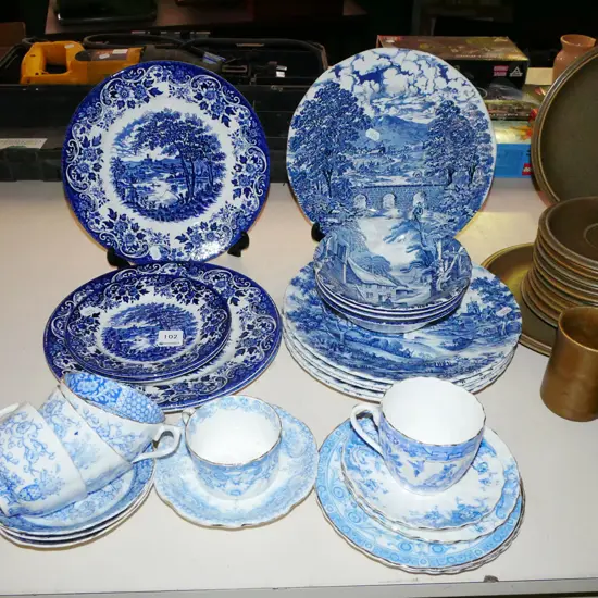 blue and white plates, bowls, cups etc