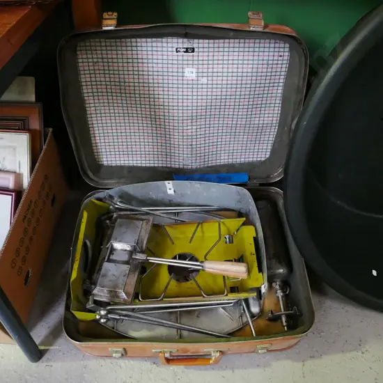 vintage broken suitcase, white spirits camp stove and bbq