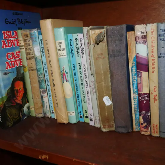 shelf of Enid Blyton books