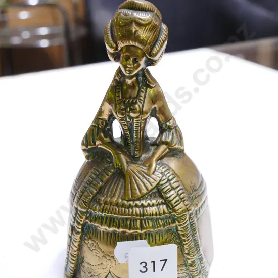 brass female figurine bell