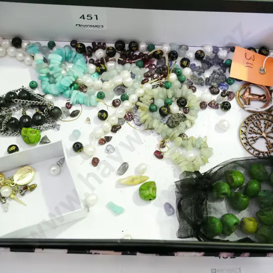 tray of various beads, stud earrings