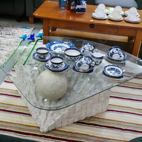 composite based bevelled edge glass top triangular coffee table H-410 W-1260 D-950