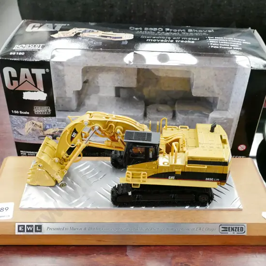die cast scale model 1:50 of a Cat 365C front shovel with metal track on presentation base