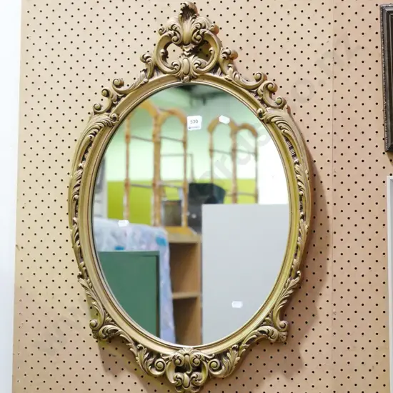 ornate gilt framed wall mirror