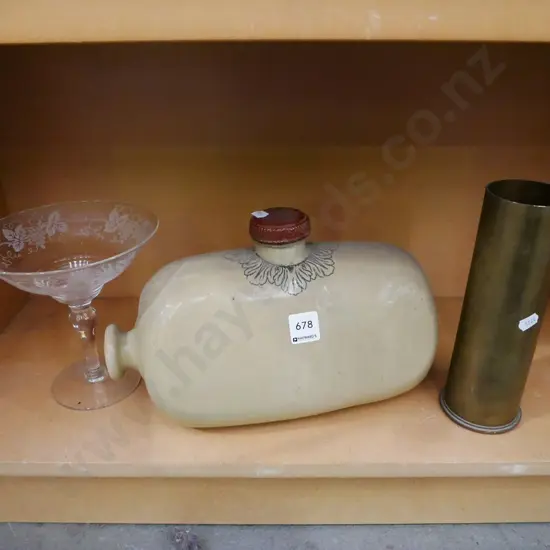 shell casing , hot water bottle, etched comport