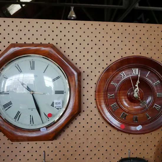 2x wall clocks - red dots