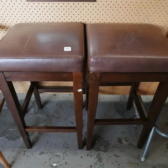 2x wood and brown vinyl stools