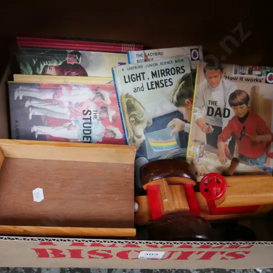 box; wooden tractor and trailer, shanty town badge, adult parody books