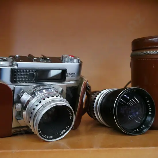 vintage Paxette film camera with additional lens