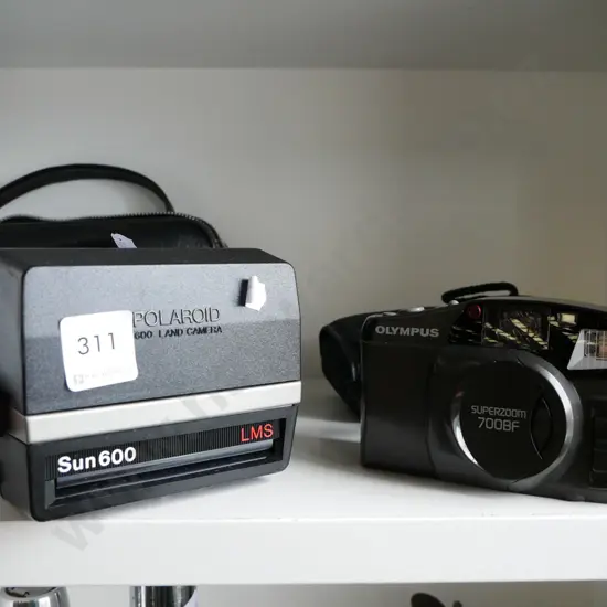 Polaroid land camera, Olmpus 35mm camera