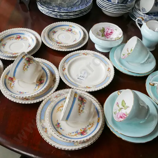 assorted cups, saucers, plates, creamer, sugar