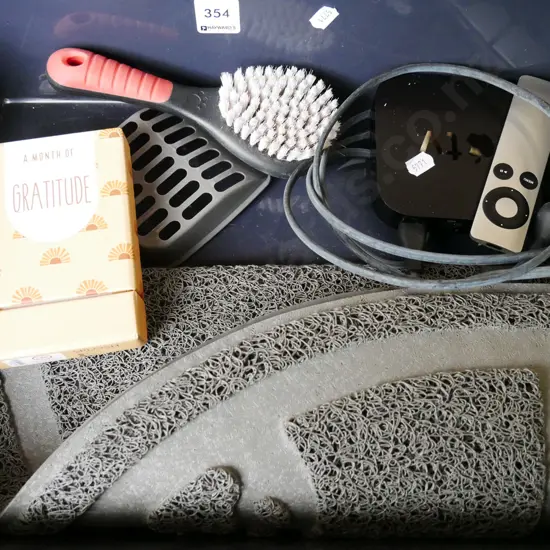 plastic tray; apple TV set, brush, bathmat etc