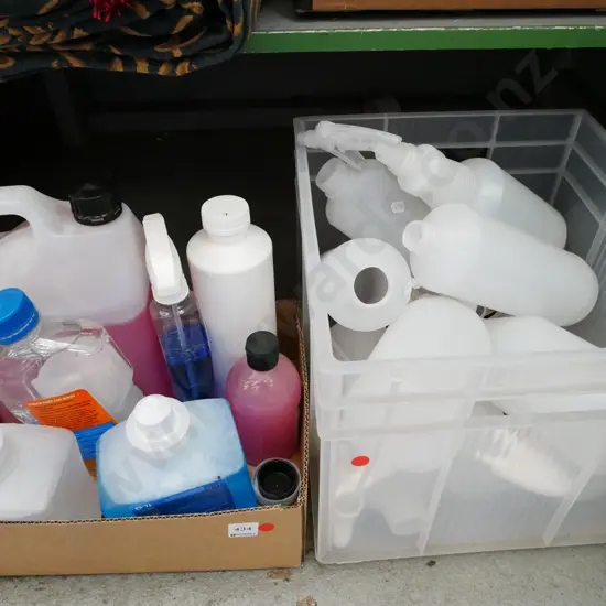 box; various cleaning chemicals, plastic tub of spray bottles - red dots