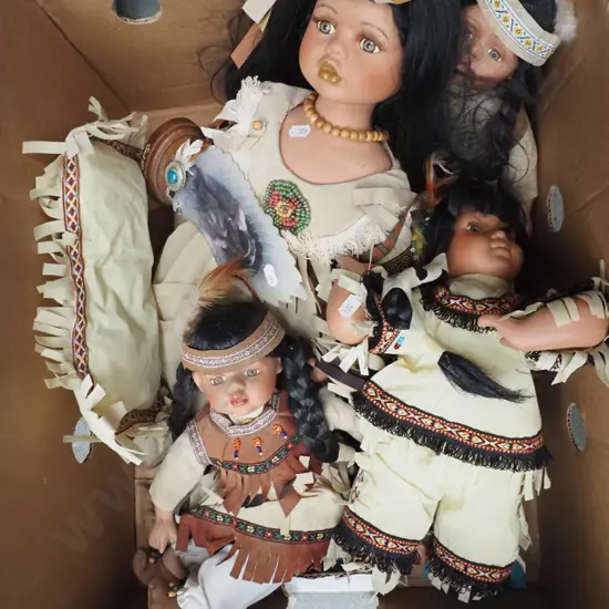 box of First Nation porcelain dolls