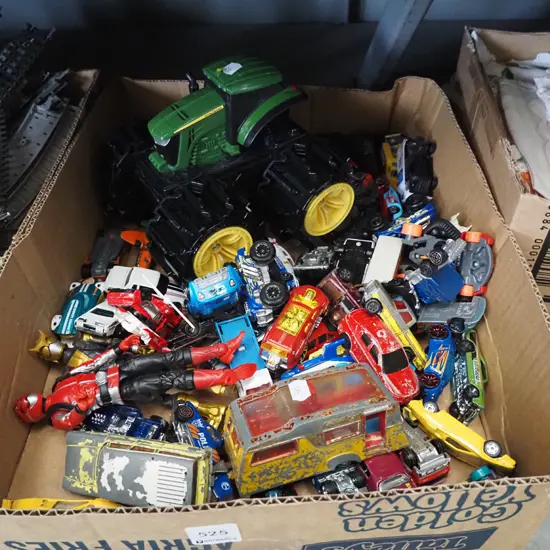 box of toy vehicles and figurines