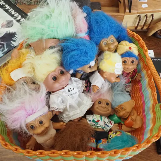 plastic basket of troll dolls