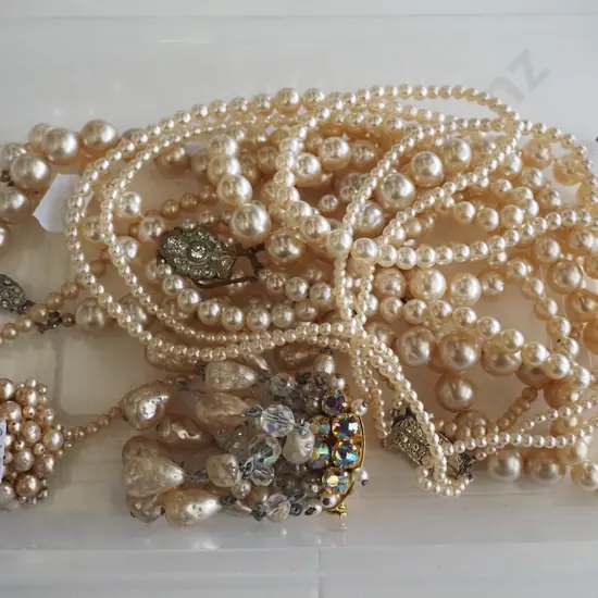 faux pearl necklaces, brooches