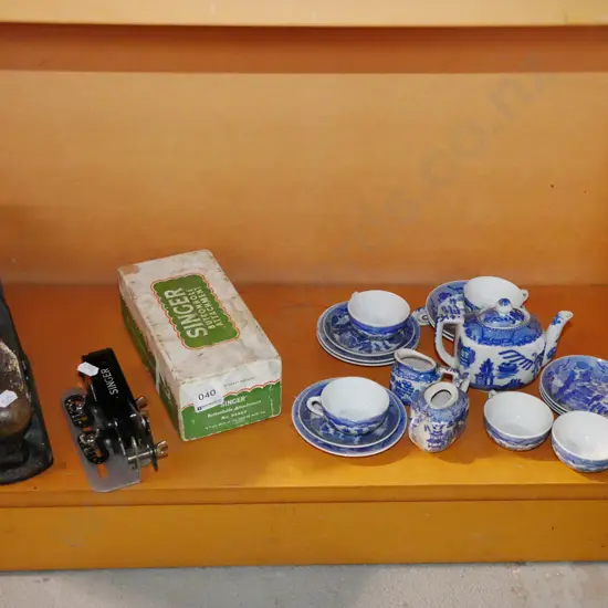 shelf; vintage hand plane, Singer sewing machine, button holer, miniature tea set
