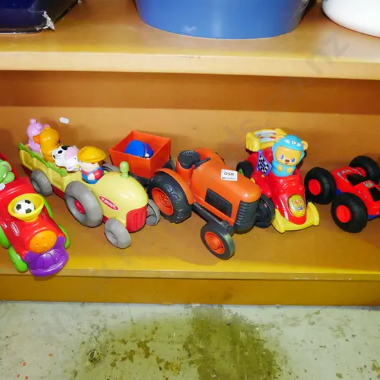 shelf of children's toys; trains, tractors etc