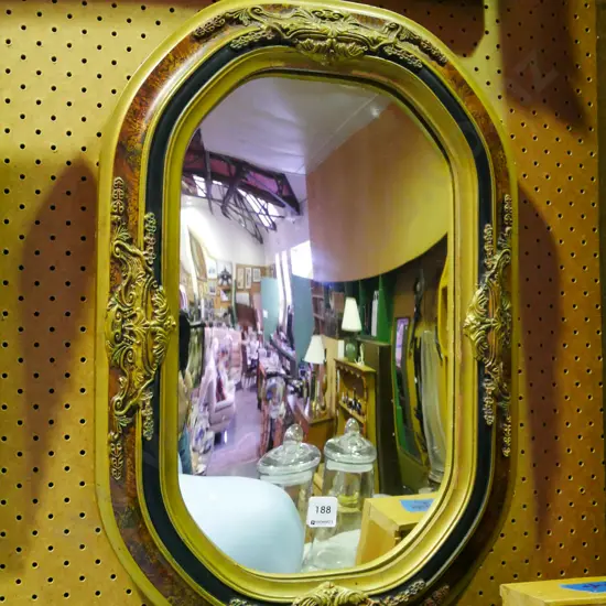 ornate oval convex wall mirror