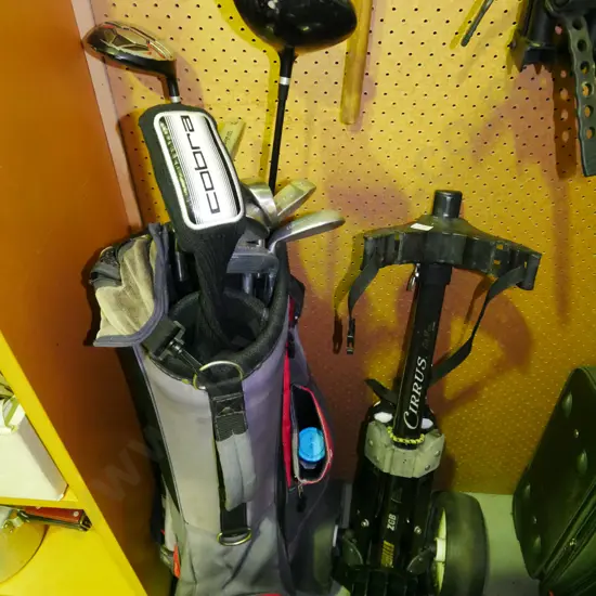 golf clubs and trundler
