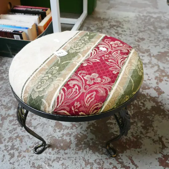 small wrought metal and upholstered footstool