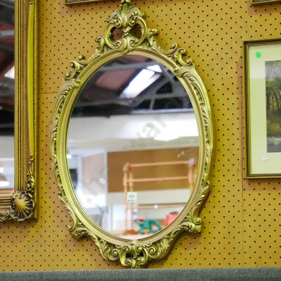 oval gilt framed wall miror