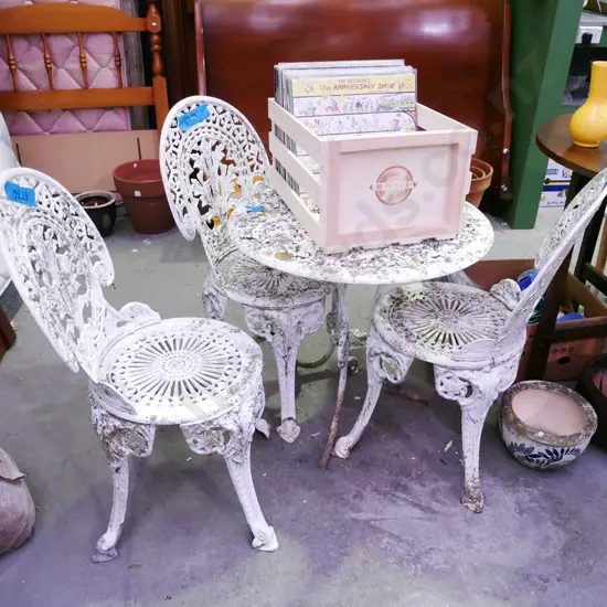 cast alloy patio table and 3 chairs