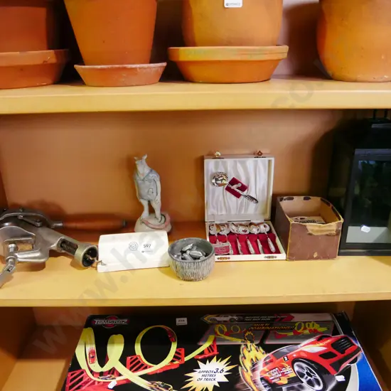 shelf; corkscrew, teaspoons etc