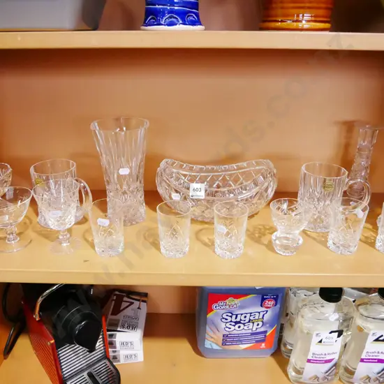 shelf of crystal tumblers, beer mug etc