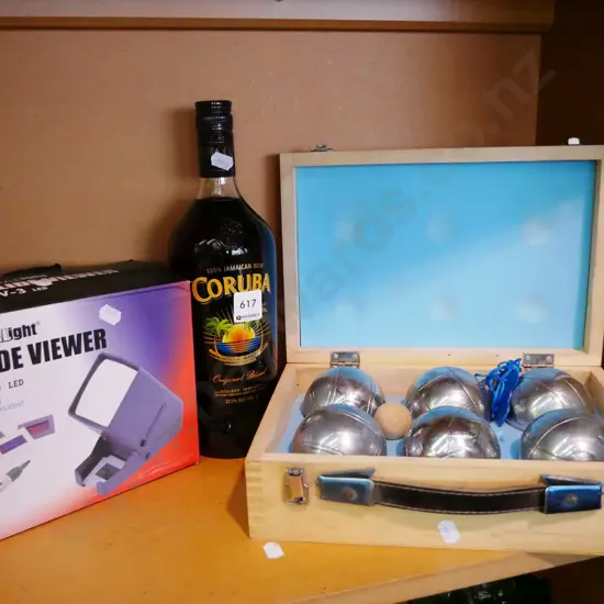 slide viewer, bottle of rum, petanque set