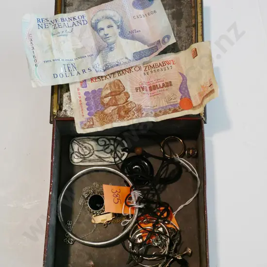 tin, old bank notes, costume jewellery