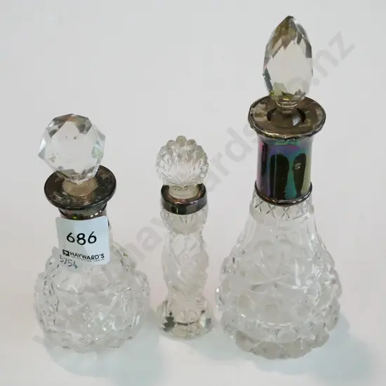 3x cut crystal and silver rimmed scent bottles