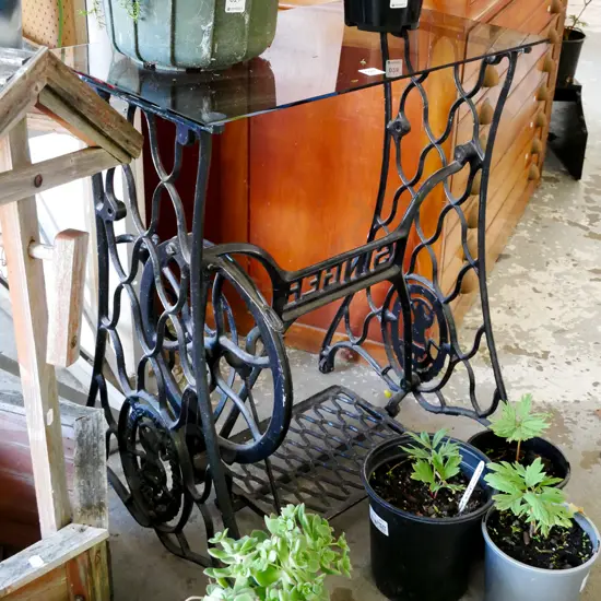 smoked top glass top on Singer treadle sewing machine base