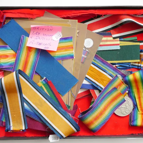 tray of various British WWII ribbons and medal