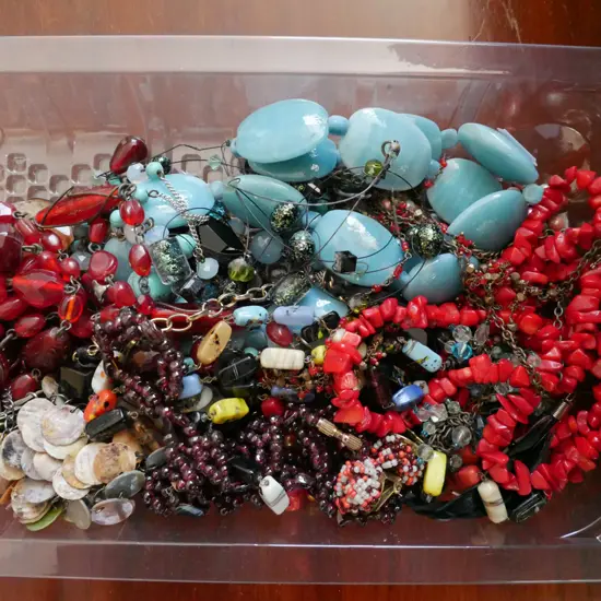 plastic tray of costume jewellery