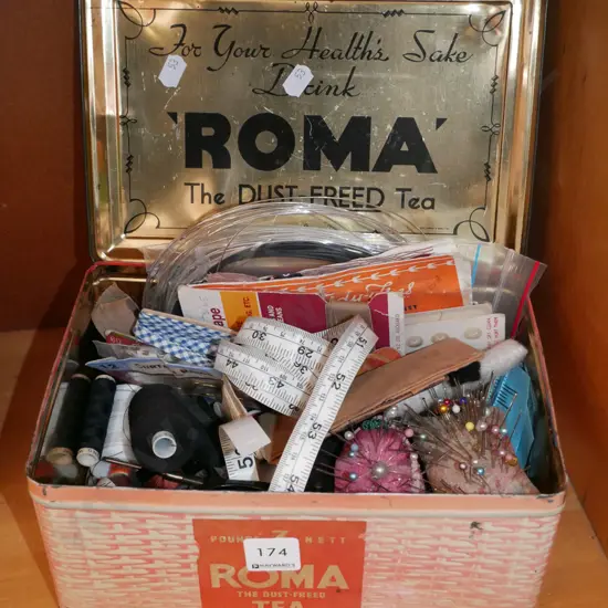 vintage tin tea box; sewing contents