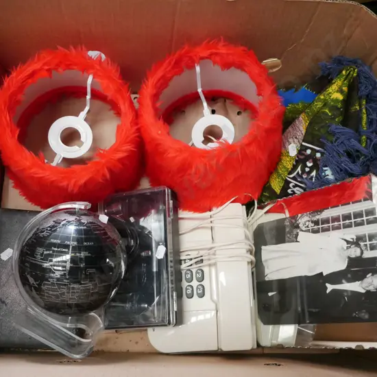 box; red fluffy lamp shades, hair brush, phone etc