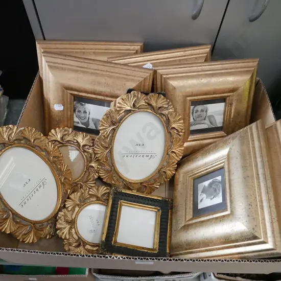 box of gilt picture frames with digital prints of Princess Diana