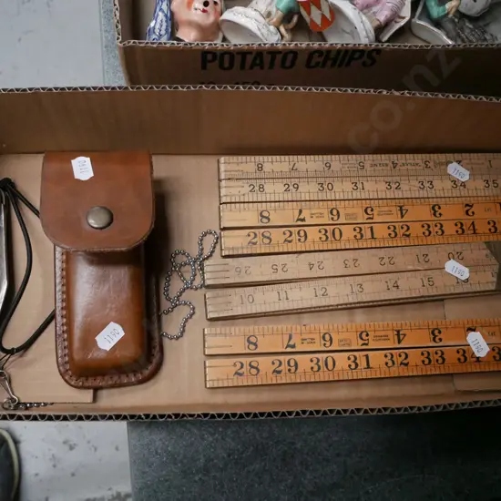 box;  vintage builder's rulers, pocket knife in leather case