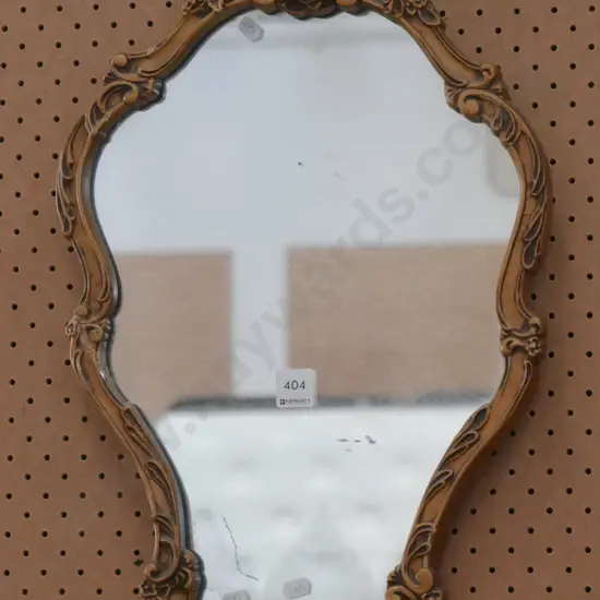 ornate gilt framed wall mirror