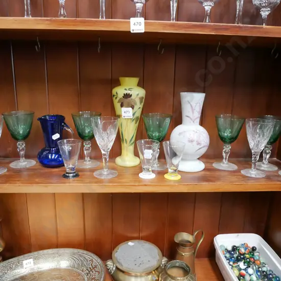 shelf of glass ware; wine glasses, vases, jug