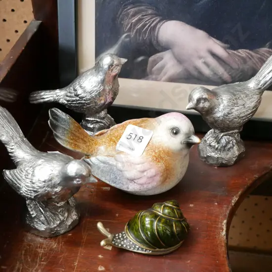 bird and snail figurines