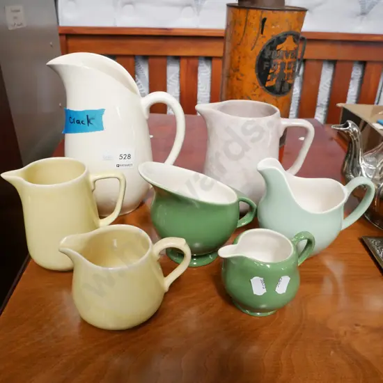 assorted ceramic jugs, tallest has crack