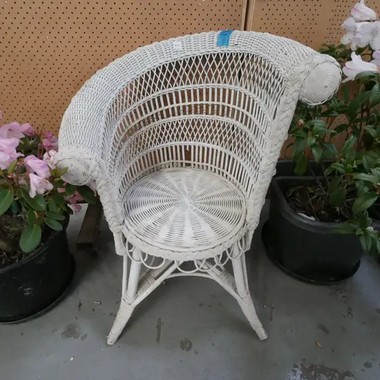 white painted cane asymetrical armchair