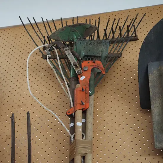 garden tools; pole pruner, hoes, rakes