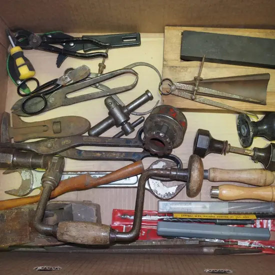 box; sharpening stones, drill bits, tin snips etc